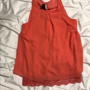 Salmon pink sleeveless blouse